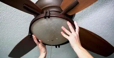Ceiling fan repair and reinstallation on ceiling mount in Seattle, WA