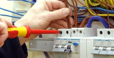 electrician services performing professional electrical panel wiring and connections in Seattle, WA