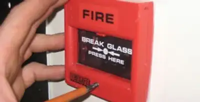fire alarm installation service showing manual fire alarm pull station installed by licensed electricians in Seattle, WA