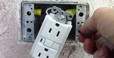 gfci circuits service showing installation of a ground fault circuit interrupter outlet by licensed electricians in Seattle, WA
