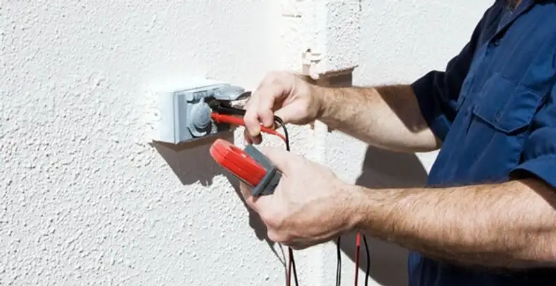 Electrician performing home electrical outlet and wiring inspection in Seattle, WA
