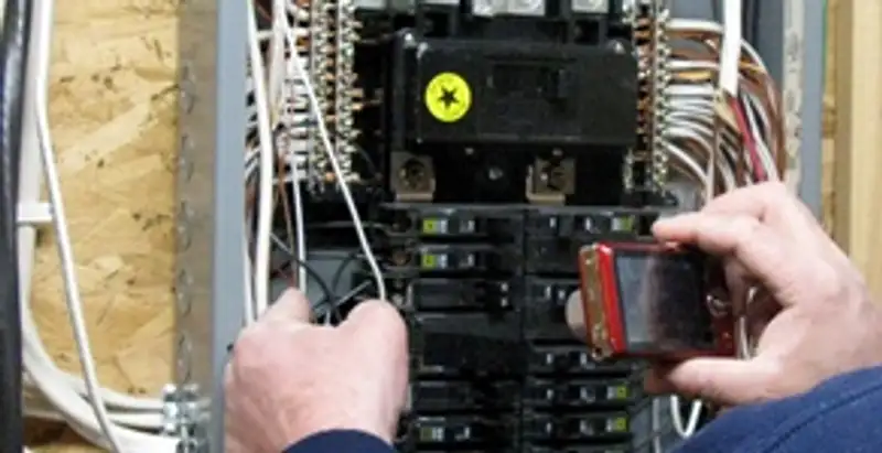 Home electrical inspection of circuit breaker panel by licensed electrician in Seattle, WA