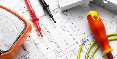 licensed electrician planning and testing electrical systems using professional tools in Seattle, WA
