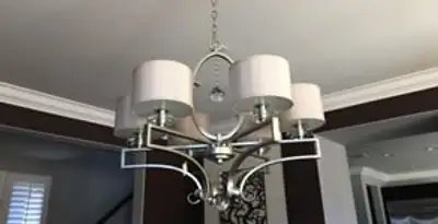 Modern chandelier installation with multiple light fixtures in Seattle, WA