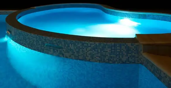 pool light installation and repair services highlighting illuminated pool interior lighting in Seattle, WA