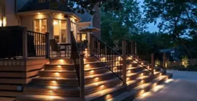 Residential electrician installing outdoor lighting for home safety in Seattle, WA