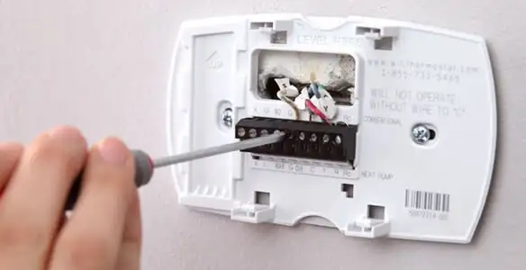 Thermostat installation service with proper wiring and secure wall mounting in Seattle, WA