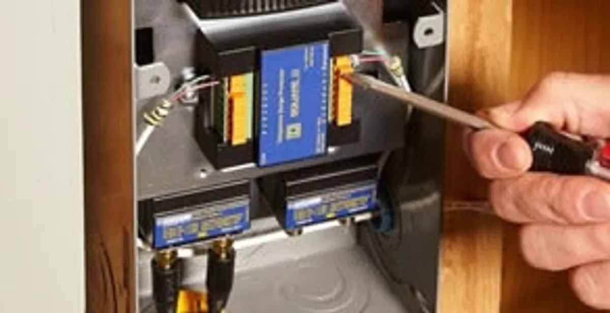 Whole home surge protection device being installed by a licensed electrician to protect electrical systems in Seattle, WA